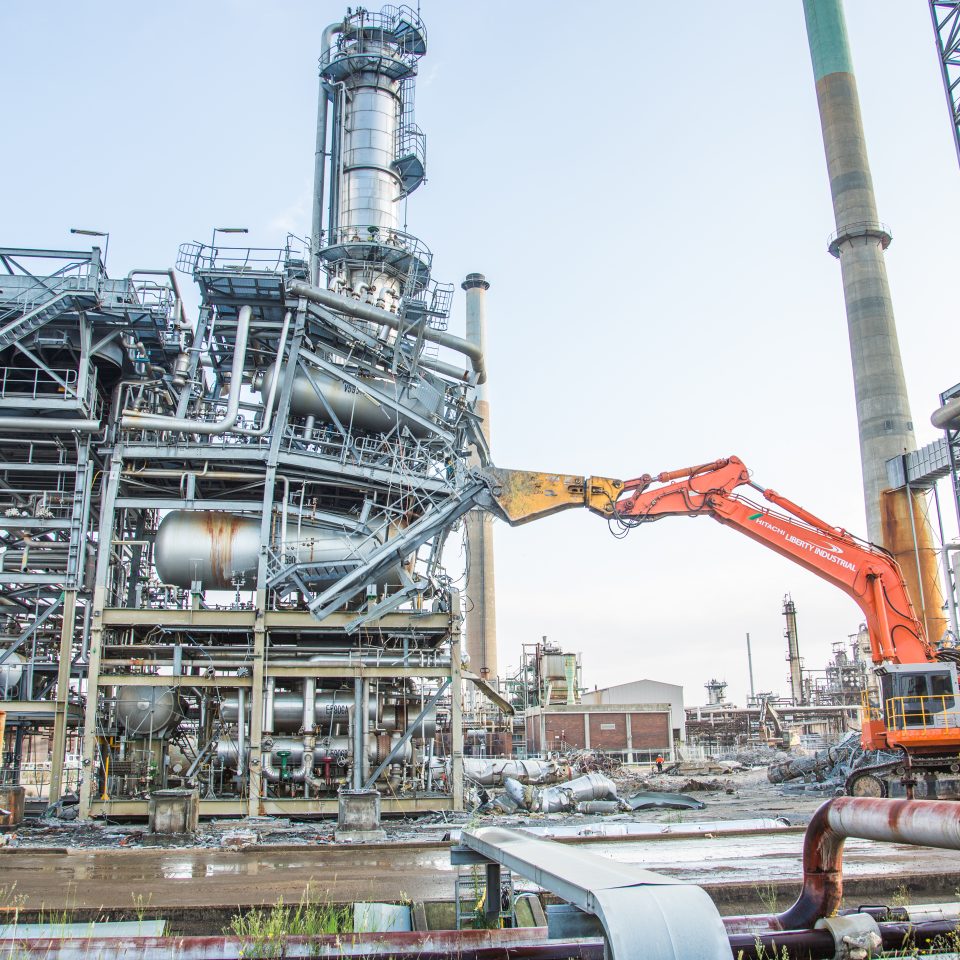 Rig demolishing a section of the Clyde Oil Refinery