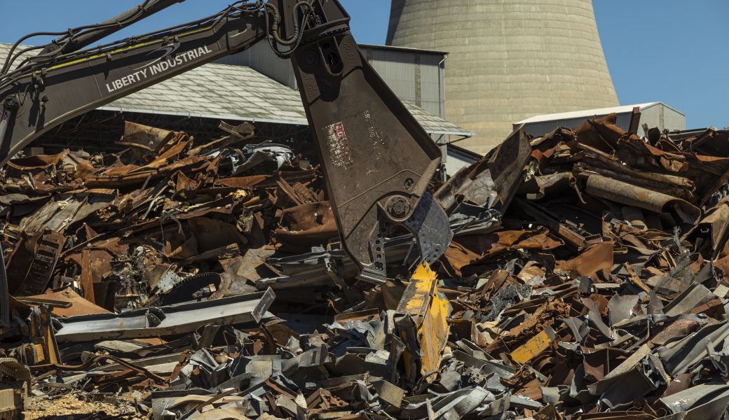 Excavator clearing scraps on the Wallerawang Power Station demolition site